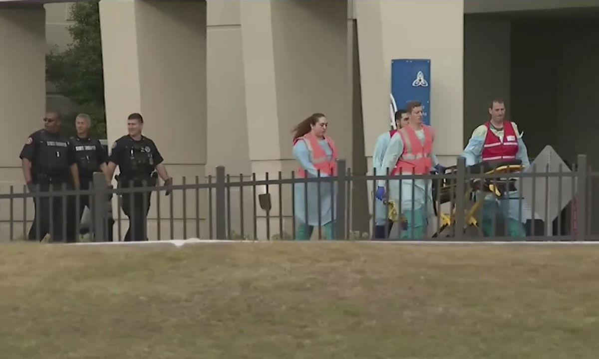 This photo taken from video provided by WEAR-TV shows emergency responders near the Naval Air Base Station in Pensacola, Fla., on Dec. 6, 2019. (WEAR-TV via AP)