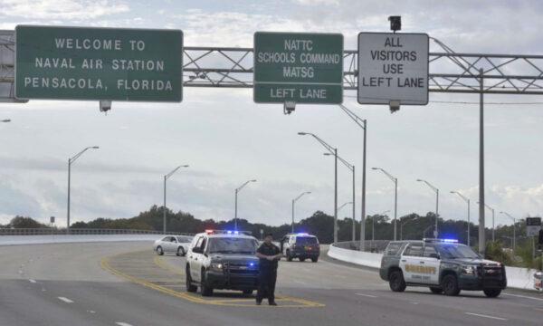 Police vehicles block the entrance to the Pensacola Air Base in Pensacola, Fla., on Dec. 6, 2019. (Tony Giberson/ Pensacola News Journal via AP)