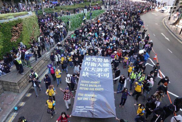 Tens of thousands of protesters march in the streets in Causeway Bay in Hong Kong on Dec. 8, 2019. (Gordon Yu/The Epoch Times)