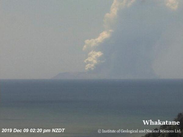Smoke bellows from Whakaari, also known as White Island, volcano as it erupts in New Zealand, Dec. 9, 2019, in this image obtained via social media. (GNS Science via REUTERS)