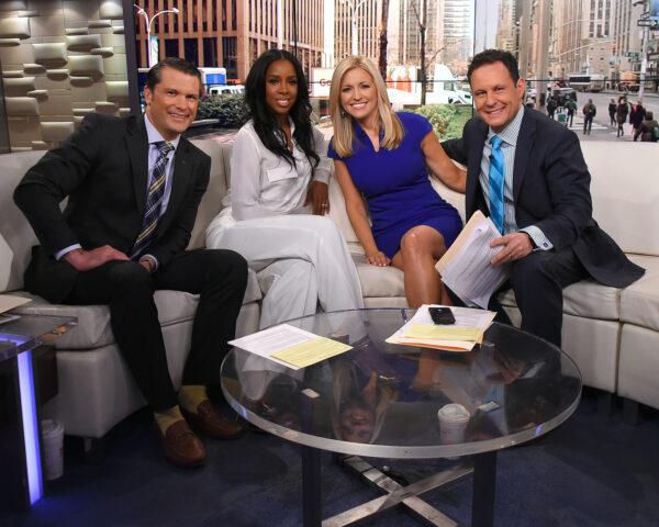 Singer Kelly Rowland (2L) is interviewed by co-hosts (L-R) Pete Hegseth, Ainsley Earhardt, and Brian Kilmeade during "Fox & Friends" in New York City on March 21, 2016. (Ben Gabbe/Getty Images)