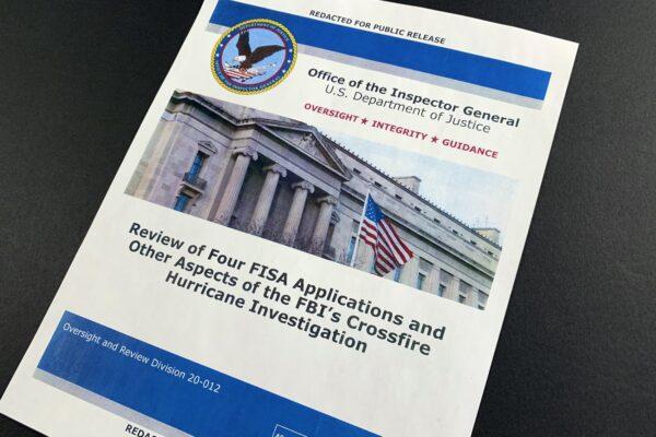 The cover page of the report issued by the Department of Justice inspector general is photographed in Washington, on Dec. 9, 2019. (Jon Elswick/AP Photo)