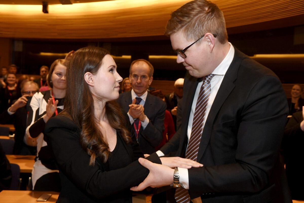 The candidate for the next prime minister of Finland, Sanna Marin is seen with runner up Antti Lindtman after the SDP's prime minister candidate vote in Helsinki, Finland, December 8, 2019. (Vesa Moilanen/Lehtikuva/via Reuters)