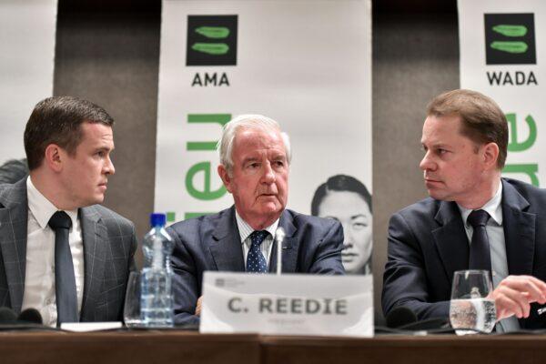 (L-R) World Anti-Doping Agency President-Elect Witold Banka, President Craig Reedie, and Director General Olivier Niggli attend a press conference in Lausanne, Switzerland, on Dec. 9, 2019. (Fabrice Coffrini/AFP/Getty Images)