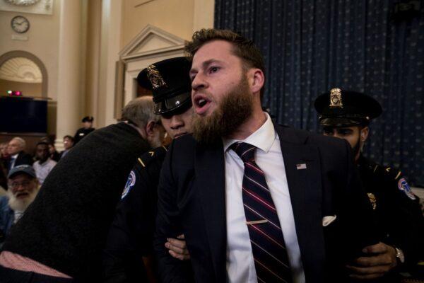 Owen Shroyer from InfoWars is removed from a public impeachment inquiry hearing with the House Judiciary Committee in the Longworth House Office Building on Capitol Hill in Washington on Dec. 9, 2019. (Anna Moneymaker-Pool/Getty Images)