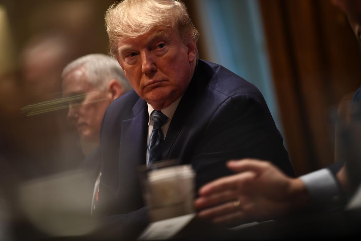 President Donald Trump participates in a roundtable on empowering families with education choice in the Cabinet Room at the White House in Washington on Dec. 9, 2019. (Brendan Smialowski/AFP via Getty Images)