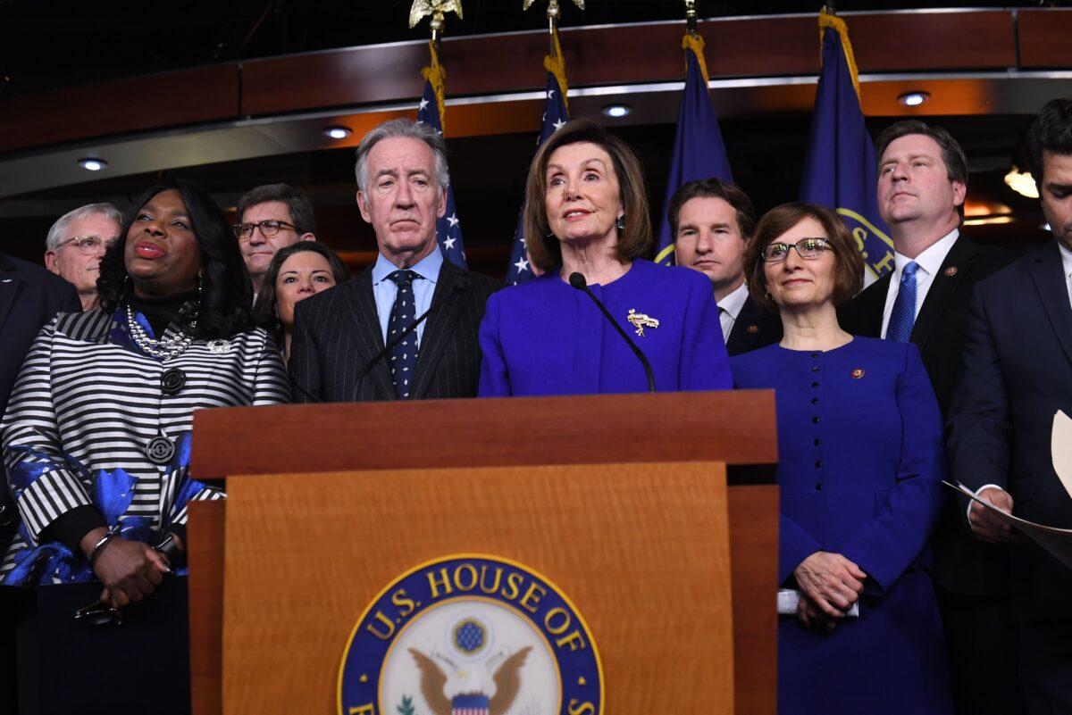 House Speaker Nancy Pelosi (D-Calif.), center, and House Ways and Means Chairman Richard Neal (D-Mass.) with other House Democrats announcing an agreement on the USMCA trade deal on Capitol Hill in Washington on Dec. 10, 2019. (Saul Loeb/AFP via Getty Images)
