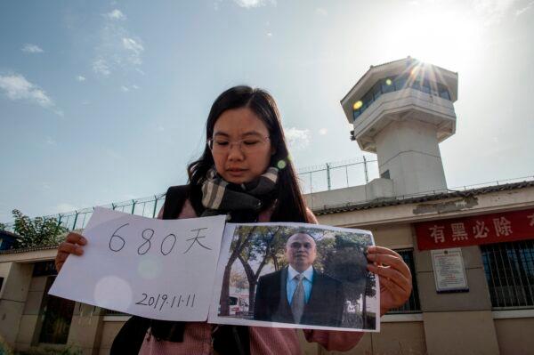 Xu Yan, wife of human rights lawyer Yu Wensheng, making a video for her husbands birthday in front of the Xuzhou City Detention Centre This picture taken on Oct. 30, 2019. Yu's birthday on Nov. 11 will mark his 680th days under detention in Xuzhou. (Nicolas Asfouri/AFP via Getty Images)