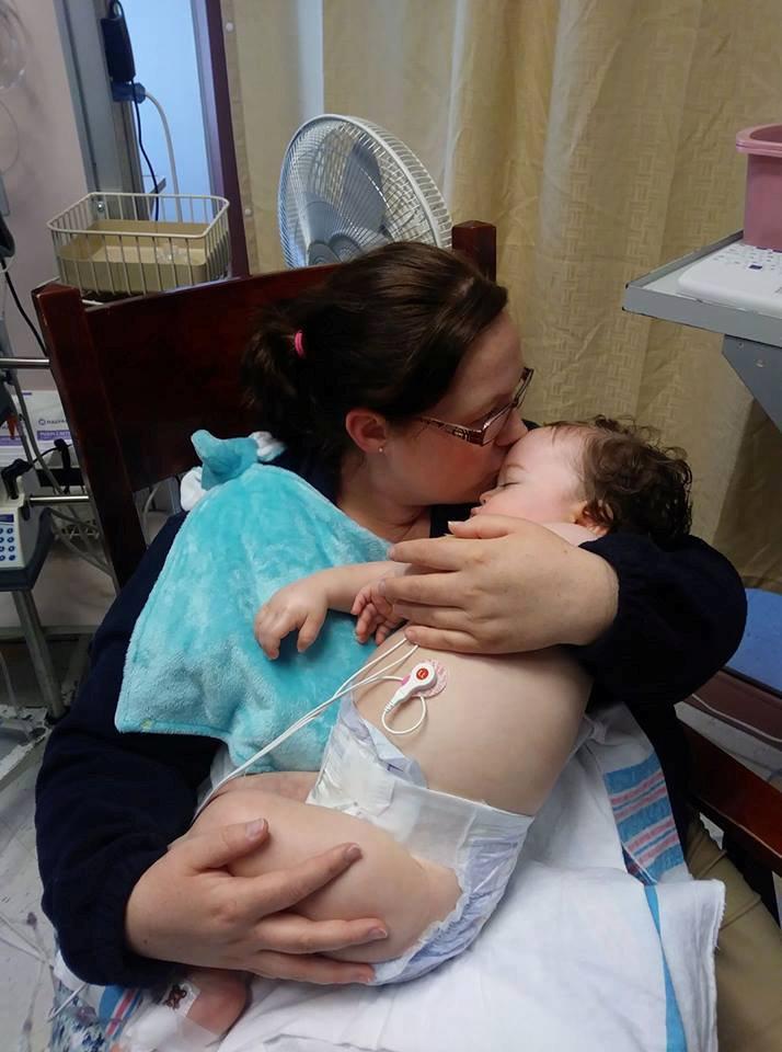Cotter and Katelyn at Hasbro Children's Hospital in Providence, where the little toddler's condition began to rapidly deteriorate and he struggled to breathe. (©SWNS)