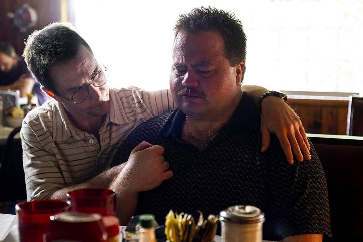 Watson Bryant (Sam Rockwell, L) consoles Richard Jewell (Paul Walter Hauser) in "Richard Jewell." (Warner Bros. Pictures)