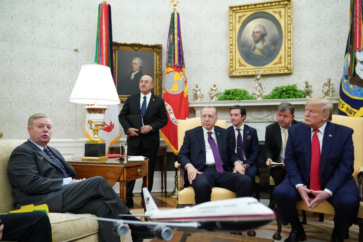 Turkey's President Recep Tayyip Erdogan, center, takes part in a meeting in the Oval Office with President Donald Trump as Sen. Lindsey Graham (R-S.C.) looks on at the White House in Washington on Nov. 13, 2019. (Mandel Ngan/AFP via Getty Images)