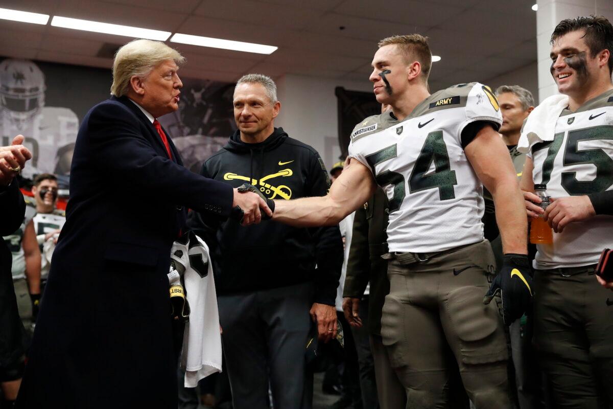 President Donald Trump shakes hands with Army player Cole Christiansen in Philadelphia, on Dec. 14, 2019. (Jacquelyn Martin/AP Photo)