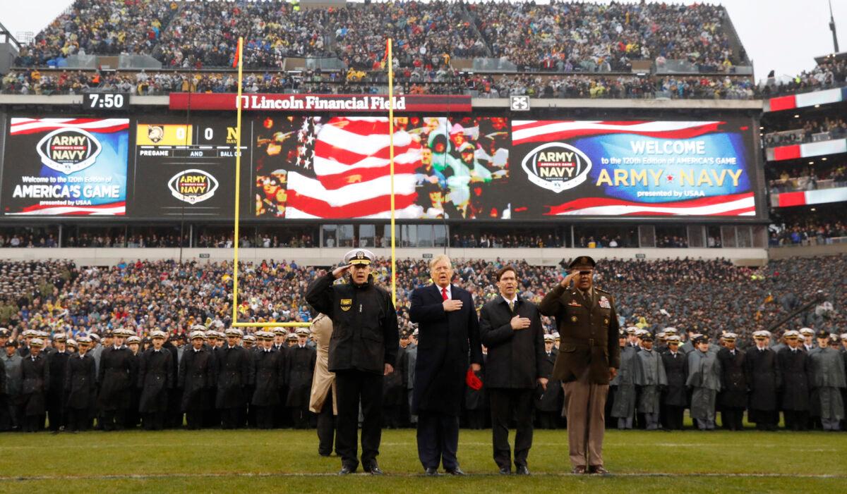 President Donald Trump stands for the Pledge of Allegiance before the start of the Army-Navy college football game in Philadelphia, Pa., on Dec. 14, 2019. (Jacquelyn Martin/AP Photo)