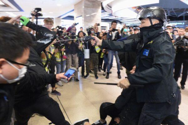 Police deploy pepper spray during a protest at the New Town Plaza shopping mall in Sha Tin in Hong Kong on Dec. 15, 2019. (Philip Fong/AFP via Getty Images)