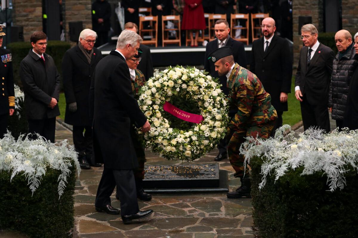 Belgium's King Philippe, front, puts a wreath to pay tribute next to U.S. Secretary of Defense Mark Esper, left, German President Frank-Walter Steinmeier, second left, Poland's President Andrej Duda, fourth right, European Council President Charles Michel, third right, and other authorities during a ceremony to commemorate the 75th anniversary of the Battle of the Bulge at the Mardasson Memorial in Bastogne, Belgium on Monday, Dec. 16, 2019. The Battle of the Bulge, also called Battle of the Ardennes, took place between Dec. 1944 and Jan. 1945 and was the last major German offensive on the Western Front during World War II. (AP Photo/Francisco Seco)