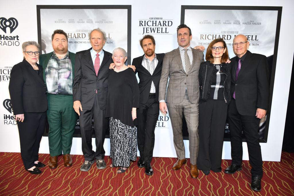 (L–R) Kathy Bates, Paul Walter Hauser, Clint Eastwood, Barbara "Bobi" Jewell, Sam Rockwell, Jon Hamm, Nadya Bryant, and G. Watson Bryant Jr. at the "Richard Jewell" screening at Rialto Center of the Arts in Atlanta, Georgia, on Dec. 10, 2019 (©Getty Images | <a href="https://www.gettyimages.com/detail/news-photo/kathy-bates-paul-walter-hauser-clint-eastwood-barbara-bobi-news-photo/1193216672?adppopup=true">Derek White</a>)
