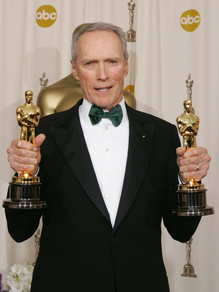 Eastwood poses with his Best Director and Best Motion Picture awards for "Million Dollar Baby" at the 77th Academy Awards in Hollywood, California, on Feb. 27, 2005. (©Getty Images | <a href="https://www.gettyimages.com/detail/news-photo/united-states-clint-eastwood-poses-with-the-best-director-news-photo/52251807?adppopup=true">JEFF HAYNES</a>)