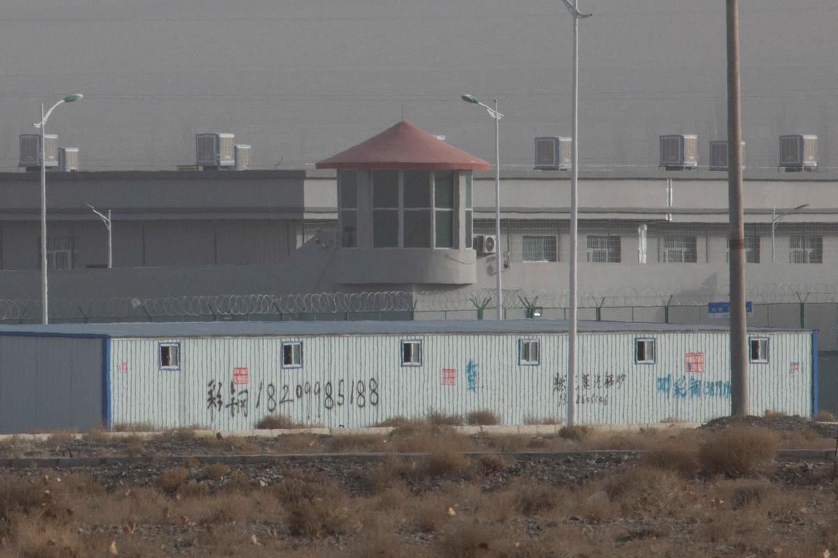A guard tower and barbed wire fences are seen around a facility in the Kunshan Industrial Park in Artux in western China's Xinjiang region on Dec. 3, 2018. (Ng Han Guan/AP Photo)