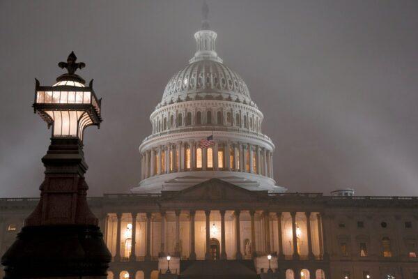 The U.S. Capitol in Washington is shrouded in mist, on the night of Dec. 13, 2019. (J. Scott Applewhite/AP Photo)