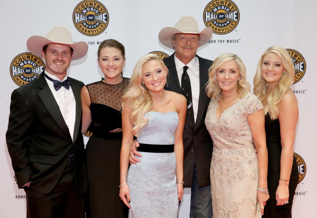 Jackson and family: (L–R) Ben Selecman, Mattie, Dani, Denise, and Alexandra Jackson at the Country Music Hall of Fame celebrating Jackson's induction on Oct. 22, 2017 (©Getty Images | <a href="https://www.gettyimages.com/detail/news-photo/alan-jackson-and-family-ben-selecman-mattie-jackson-dani-news-photo/865195980?adppopup=true">Terry Wyatt</a>)