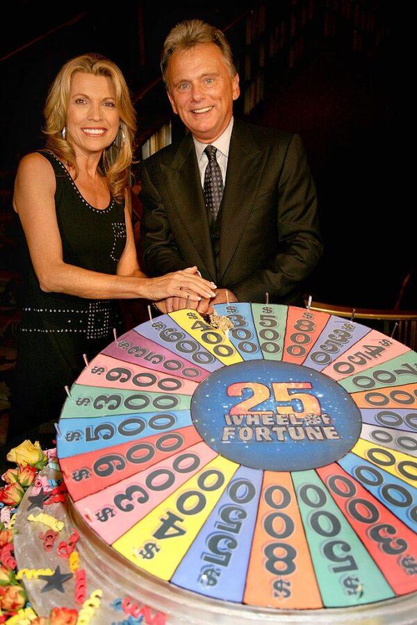 Pat Sajak and model Vanna White cut cake at the the 25th anniversary celebration of the television game show "Wheel Of Fortune" at Radio City Music Hall in New York City on Sept. 27, 2007. (Photo by Astrid Stawiarz/Getty Images)