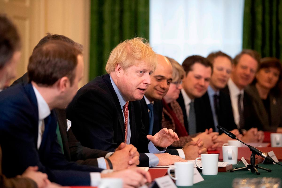 Britain's Prime Minister Boris Johnson speaks during his first cabinet meeting since the general election, inside 10 Downing Street in London on Dec. 17, 2019. (Photo by Matt Dunham/POOL/AFP/Getty Images)
