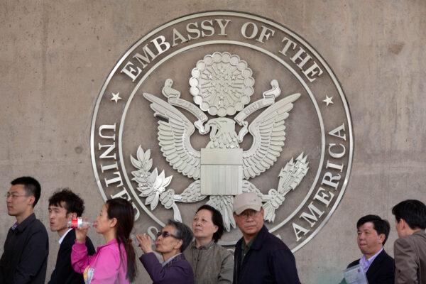 People line up outside the U.S. embassy in Beijing on April 27, 2012. (Ed Jones/AFP/Getty Images)