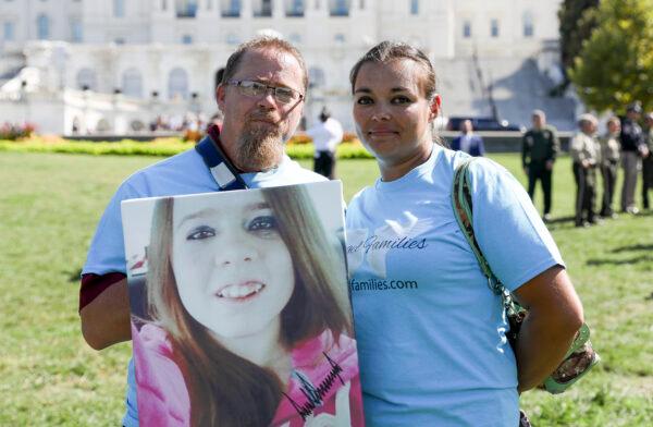 Chris Stansberry and Kimberly Roberts, who lost their daughter Tierra Stansberry to an illegal immigrant, attend an event for Angel families and sheriffs outside the Capitol building in Washington on Sept. 25, 2019. (Charlotte Cuthbertson/The Epoch Times)