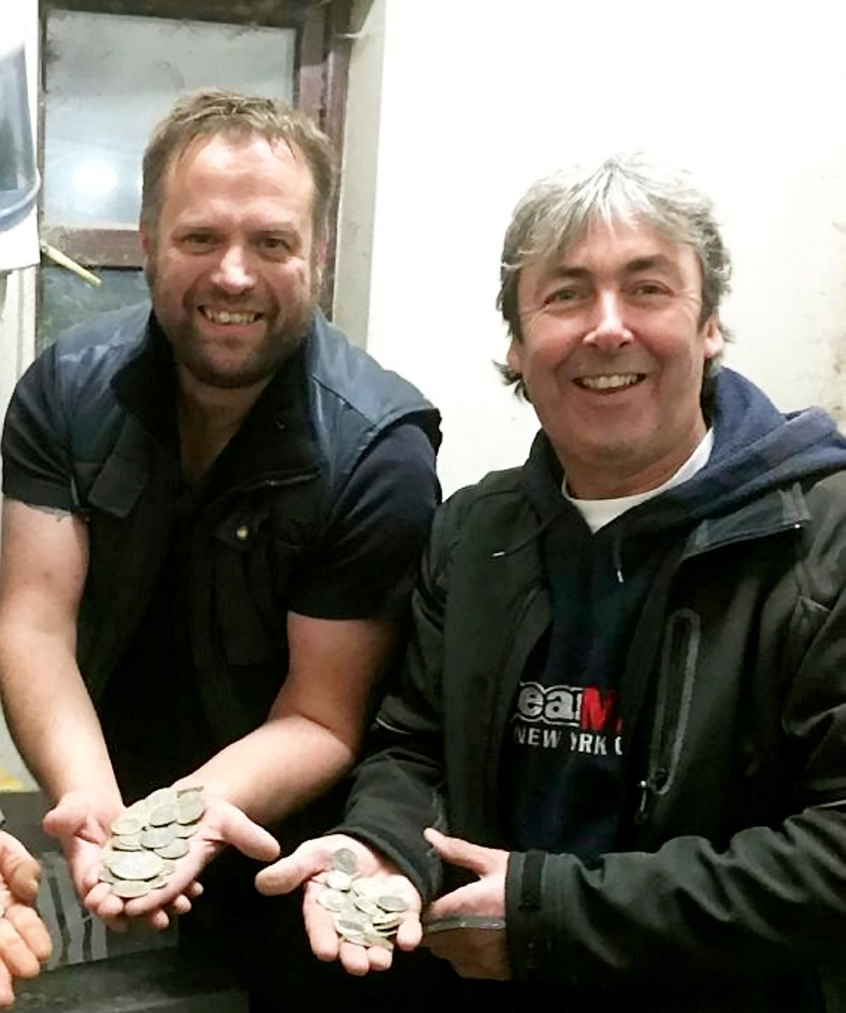 Two metal detectorists, Paul Raynard (L) and Michael Gwynne (R) discovered a hoard of fortune while finding a friend's lost wedding ring. (©SWNS)