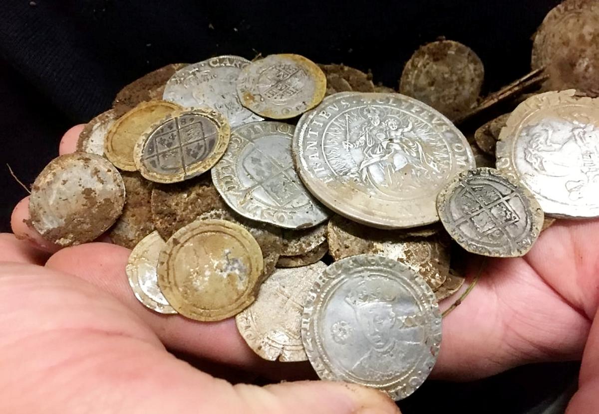 A cluster of 84 coins was found in a field near Ballycastle, Northern Ireland. (©SWNS)