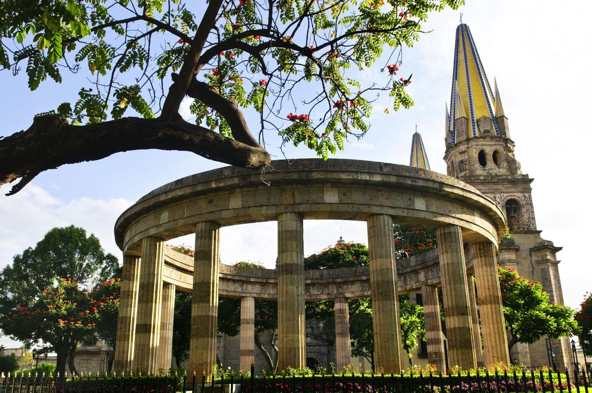 The Rotonda de los Jaliscienses Ilustres, pictured with the Cathedral of Guadalajara in the background, is a city landmark honoring men and women of the state of Jalisco who made a significant contribution to society. (Courtesy of Guadalajara Tourism Board)