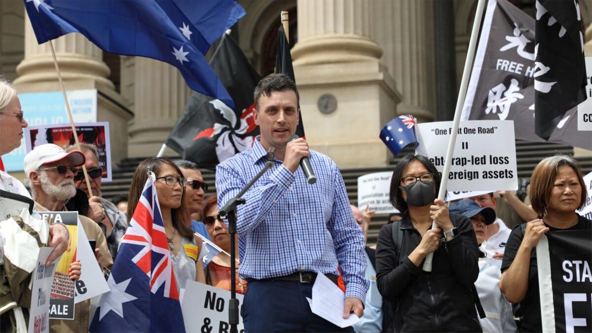 Morgan Jonas, co-organizer for the “Standing against Daniel Andrews Belt & Road Signing” rally speaks on the steps of Victoria Parliament on Dec. 15, 2019. (Grace Yu/Epoch Times)