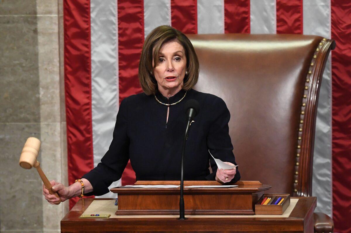 Speaker of the House Nancy Pelosi presides over Resolution 755, Articles of Impeachment Against President Donald Trump as the House votes at the U.S. Capitol in Washington, on Dec. 18, 2019. (Saul Loeb/AFP via Getty Images)
