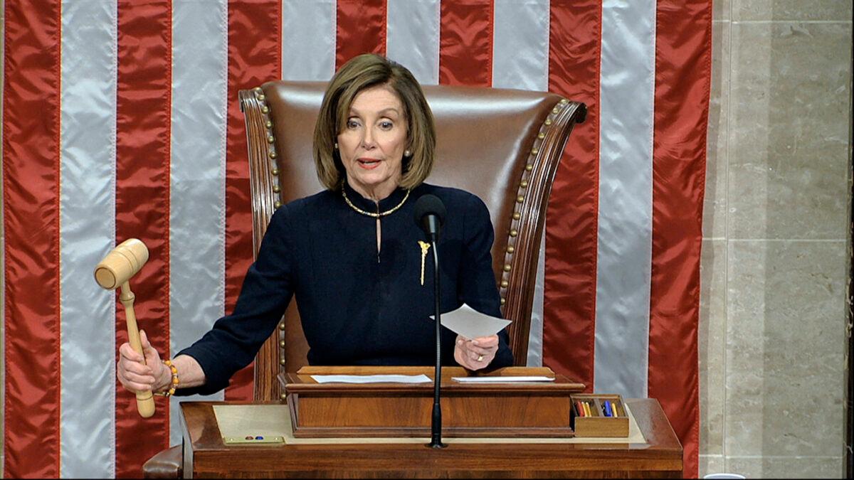 House Speaker Nancy Pelosi (D-Calif.) announces the passage of the first article of impeachment, abuse of power, against President Donald Trump by the House of Representatives at the Capitol in Washington on Dec. 18, 2019. (House Television via AP)