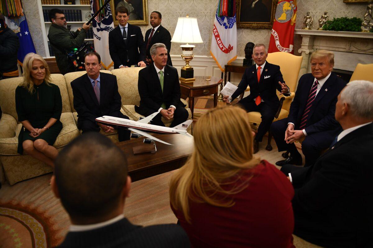 House Minority Leader Kevin McCarthy (R-Calif.), third from left, meets with President Donald Trump, right, Rep. Jeff Van Drew (R-N.J.), center-right, and cabinet members in the Oval Office at the White House in Washington on Dec. 19, 2019. (Brendan Smialowski/AFP via Getty Images)