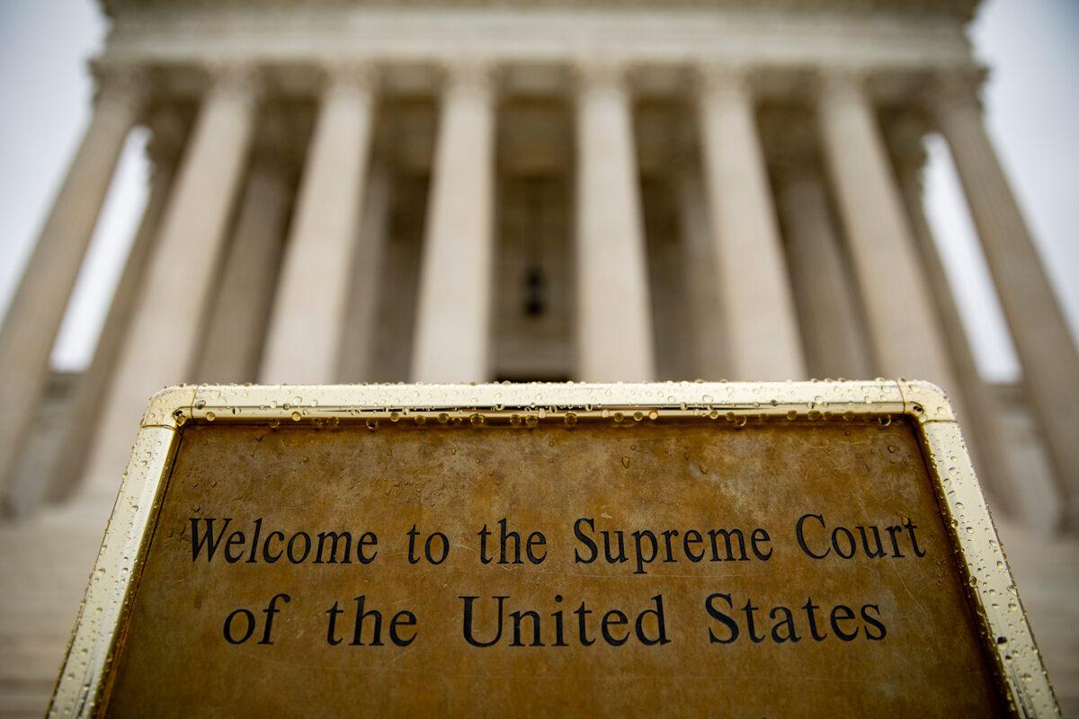 A welcome sign at the base of the steps to the U.S. Supreme Court in Washington, on Dec. 16, 2019. (Samuel Corum/Getty Images)