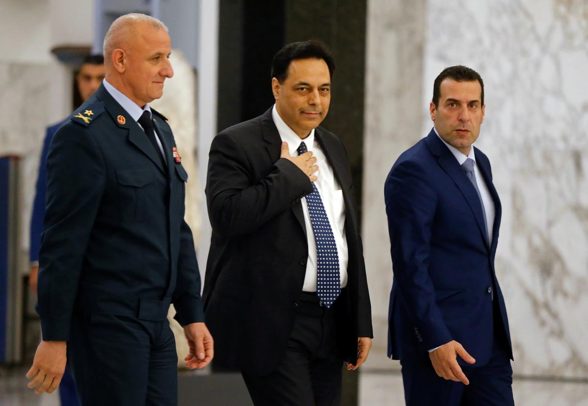 Hassan Diab, Lebanon's newly named prime minister, walks at the presidential palace in Baabda, Lebanon, on Dec. 19, 2019. (Reuters/Mohamed Azakir)