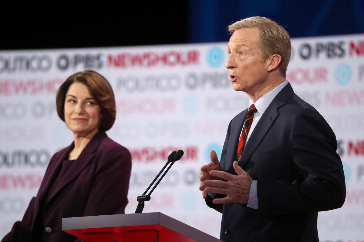 Billionaire Tom Steyer, right, speaks as Sen. Amy Klobuchar (D-Minn.) look on during the sixth Democratic primary debate of the 2020 presidential campaign season at Loyola Marymount University in Los Angeles, California on Dec. 19, 2019. (Justin Sullivan/Getty Images)