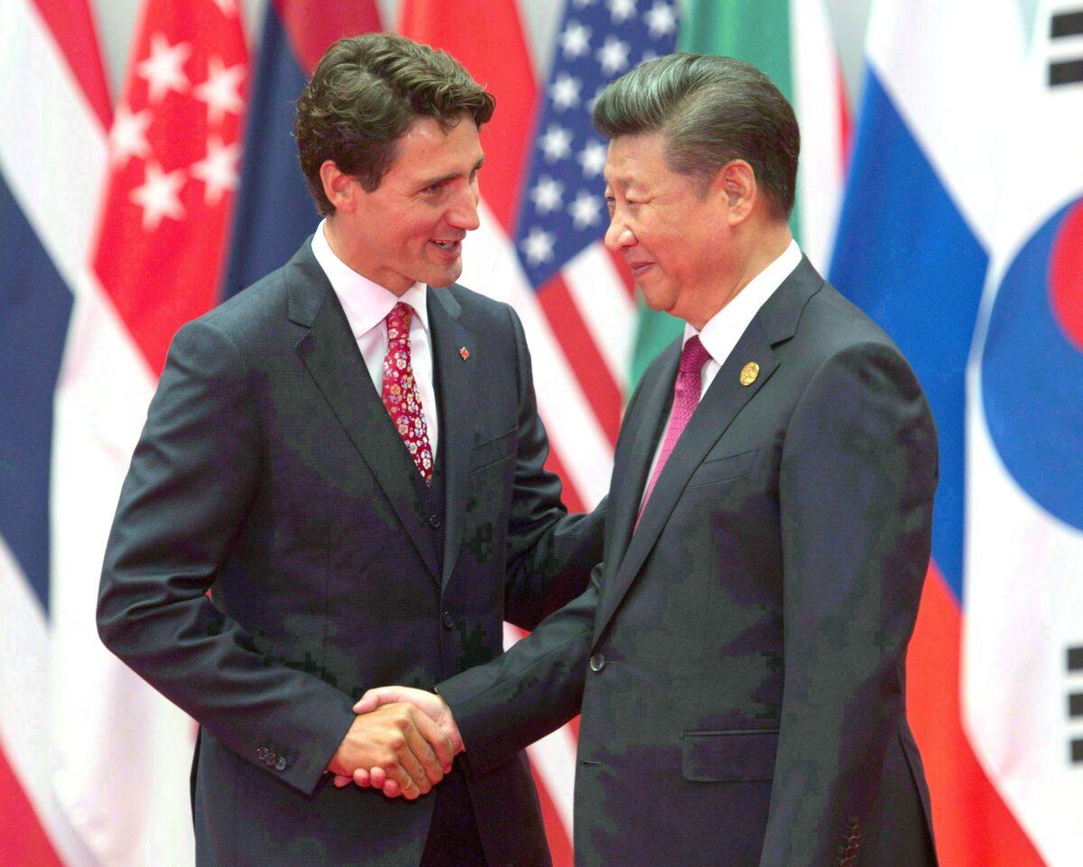 Prime Minister Justin Trudeau and Chinese leader Xi Jinping greet each other during the official welcome at the G20 Leaders Summit in Hangzhou, China, on Sept. 4, 2016. (The Canadian Press/Adrian Wyld)