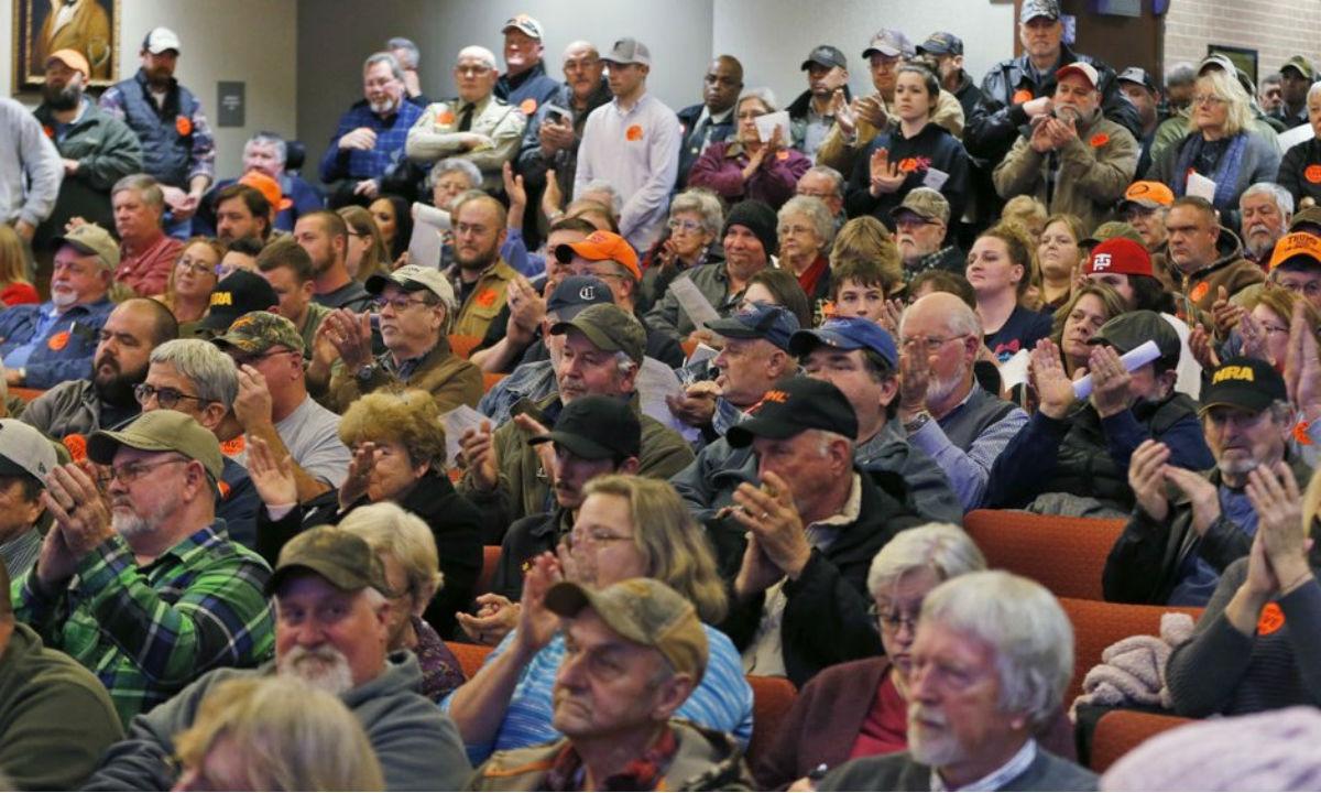 Spectators applaud as the Buckingham County Board of Supervisors unanimously voted to pass a Second Amendment Sanctuary City resolution at a meeting in Buckingham, Virginia, on Dec. 9, 2019. (Steve Helber/AP Photo)