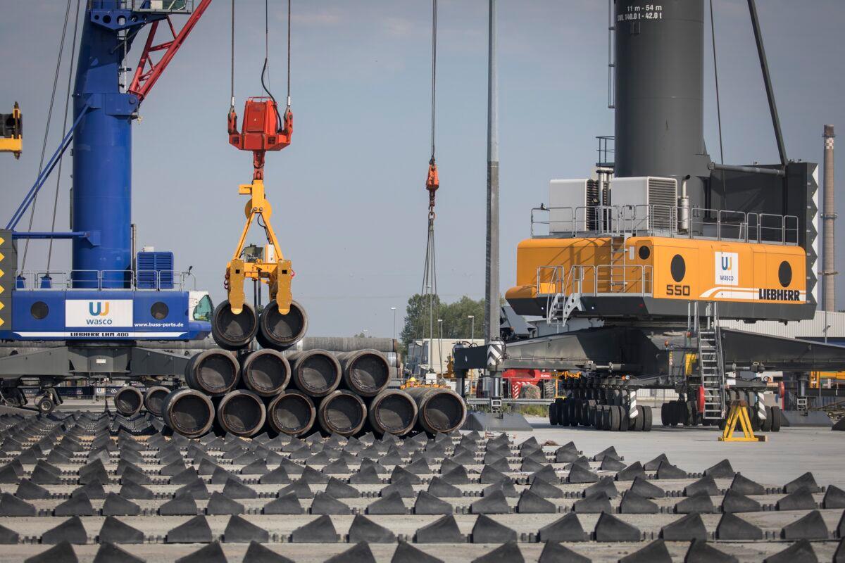 A crane moves Nord Stream 2 pipes at the Mukran port near Sassnitz, Germany on June 5, 2019. (Axel Schmidt/Getty Images)