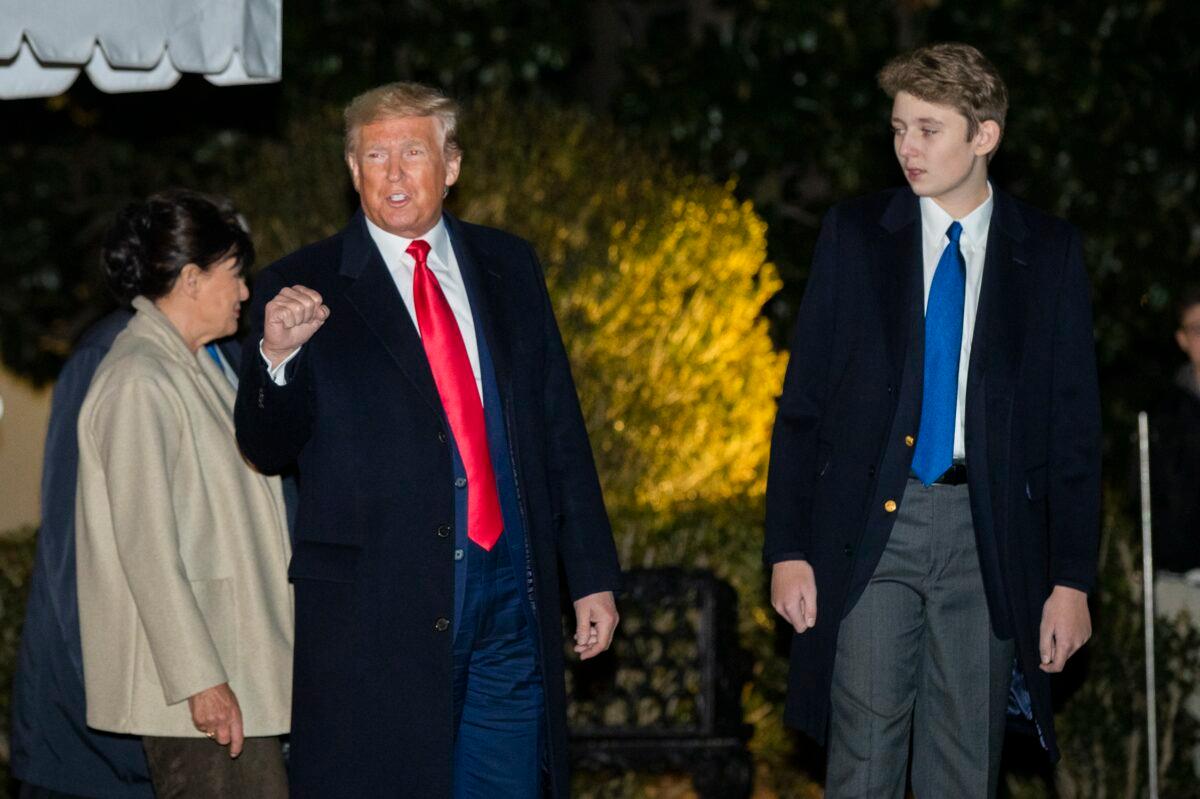 President Donald Trump with his son Barron Trump gestures as they leave the White House in Washington on Dec. 20, 2019. (Manuel Balce Ceneta/AP Photo)