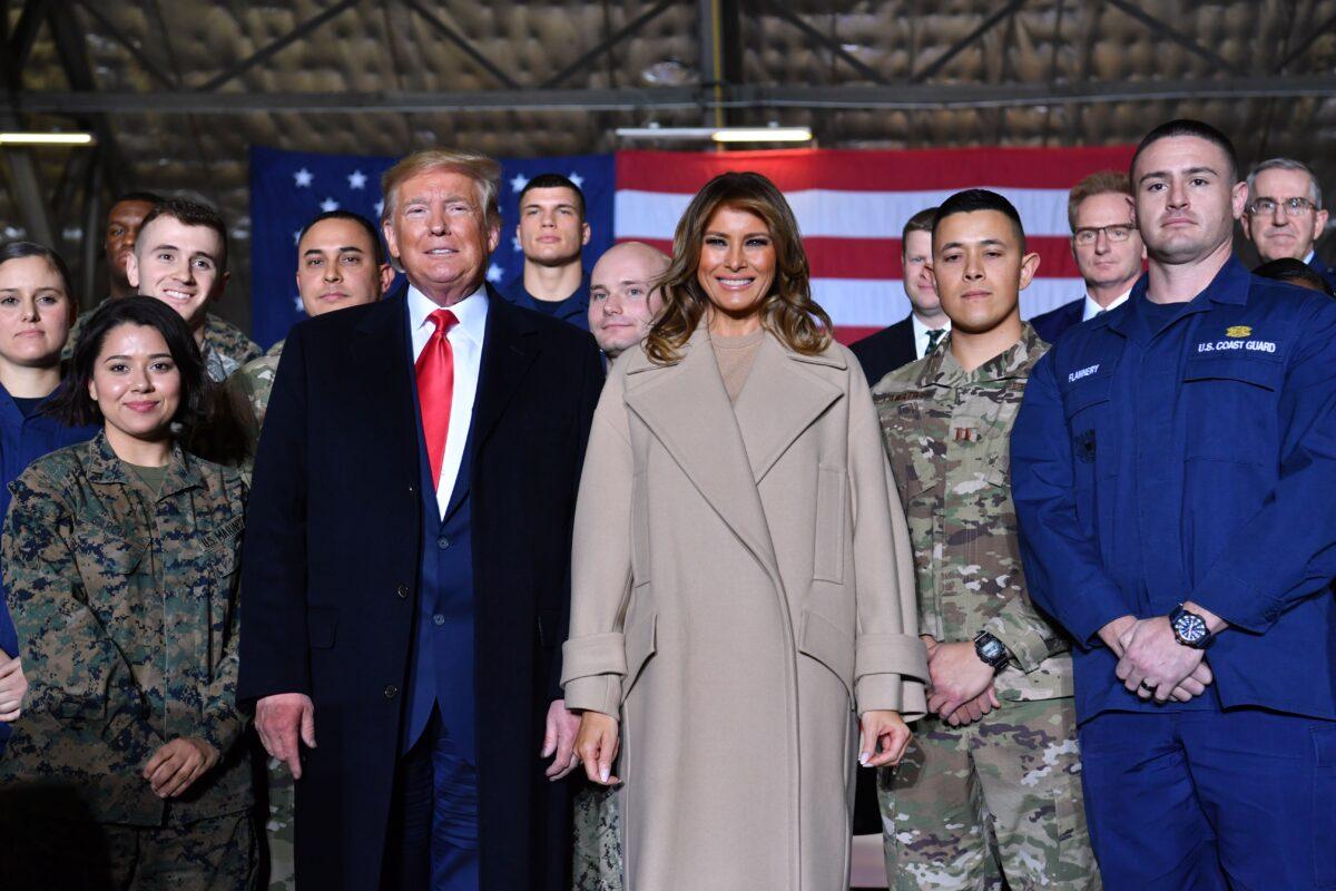 President Donald Trump with First Lady Melania Trump after signing the National Defense Authorization Act for FY2020 at Joint Base Andrews, Maryland, on Dec. 20, 2019. (Nicholas Kamm/AFP via Getty Images)