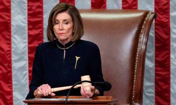 House Speaker Nancy Pelosi presides over Resolution 755, Articles of Impeachment Against President Donald Trump as the House votes at the Capitol in Washington, on Dec. 18, 2019. (Saul Loeb/AFP via Getty Images)