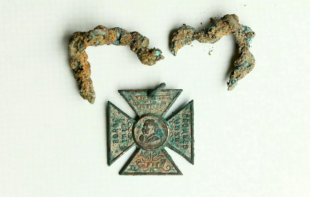 Queen Victoria's Diamond Jubilee 60 Years Cross was also discovered in the hidden well. (SWNS)