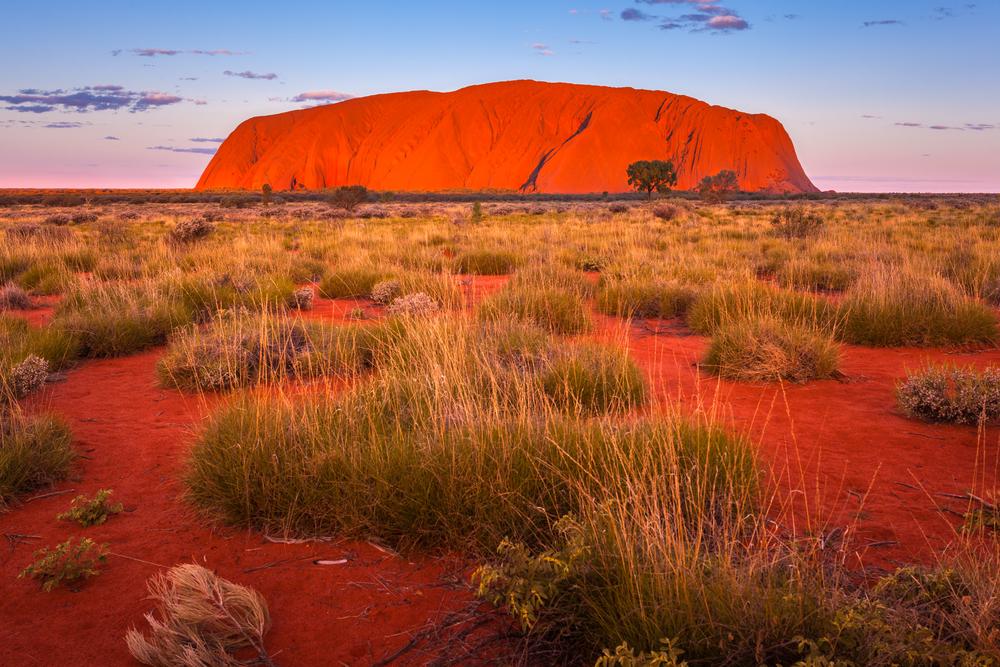 Uluru, formerly known as Ayers Rock, is reportedly the largest monolith in the world and is a sacred site for Australian aborigines. At sunset it almost seems to glow. (Shutterstock)