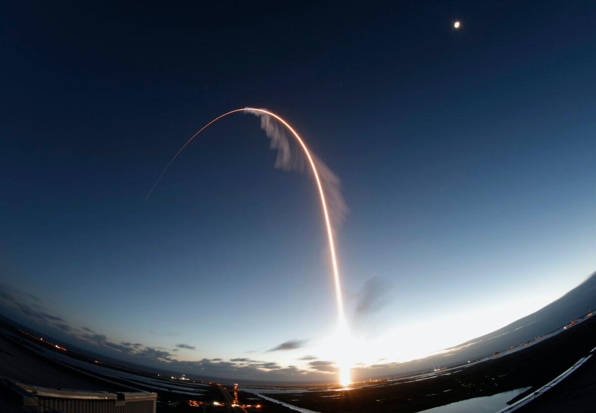 In this long exposure photo, the United Launch Alliance Atlas V rocket carrying the Boeing Starliner crew capsule lifts off on an orbital flight test to the International Space Station from Space Launch Complex 41 at Cape Canaveral Air Force Station, in Cape Canaveral, Fla. on Dec. 20, 2019. (Terry Renna/AP)