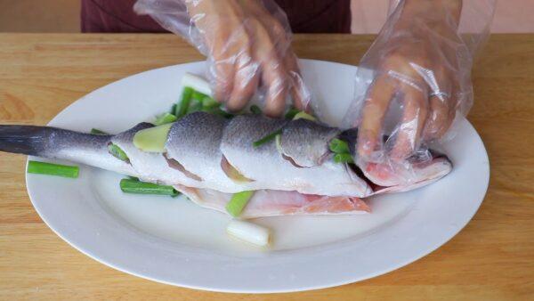 Stuff the fish with ginger and scallions. (CiCi Li)