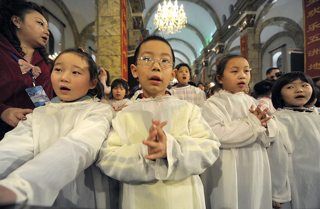 ©Getty Images | <a href="https://www.gettyimages.com/detail/news-photo/chinese-children-attend-a-holy-communion-during-christmas-news-photo/95186494">LIU JIN</a>
