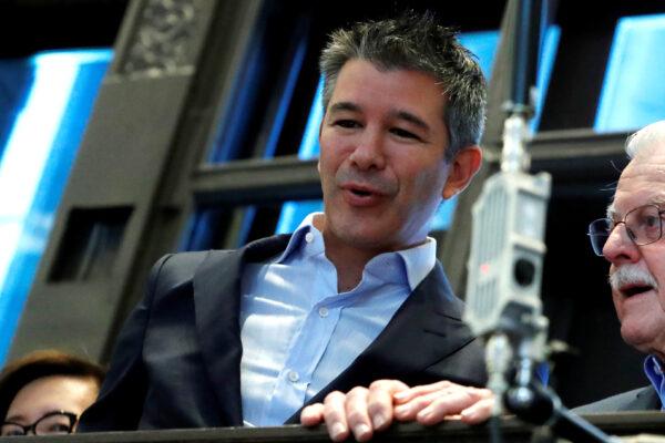 Former Uber CEO and co-founder Travis Kalanick stands on a balcony above the trading floor of the New York Stock Exchange (NYSE) during the company's IPO in New York City, on May 10, 2019. (Andrew Kelly/Reuters)